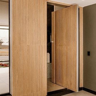 A sleek modern door with wood slats matching the wall made of Hemlock lumber