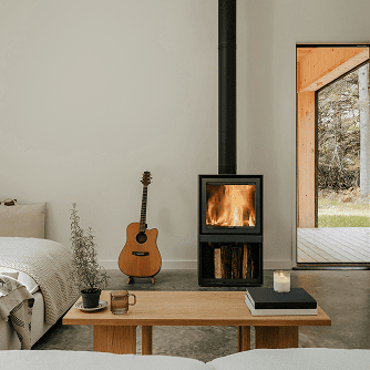 Interior of a home with a fireplace, a couch, and a coffee table made from Ponderosa Pine